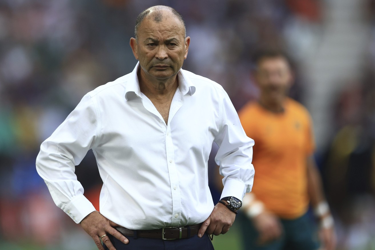 Australia's head coach Eddie Jones waits for the start of the fateful Rugby World Cup Pool C match between Australia and Fiji at the Stade Geoffroy Guichard in Saint-Etienne, France, Sunday, Sept. 17, 2023. (AP Photo/Aurelien Morissard)
