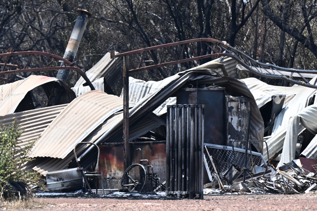 A property destroyed by bushfire near the town of Tara. (AAP Image/Darren England) 