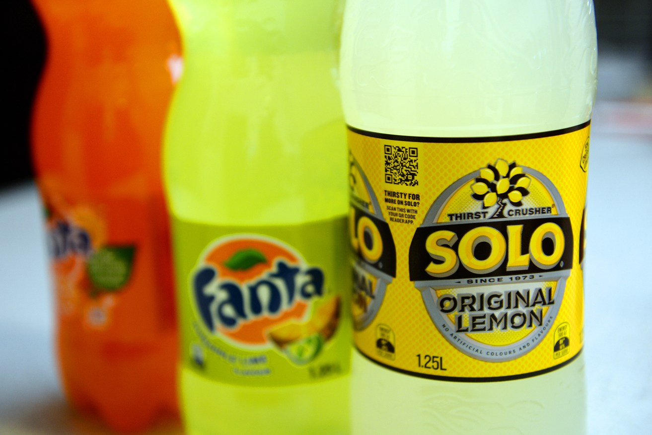 A stock image of bottles of Fanta and Solo soft drinks Friday, March 21, 2014. (AAP Image/Dan Peled) NO ARCHIVING