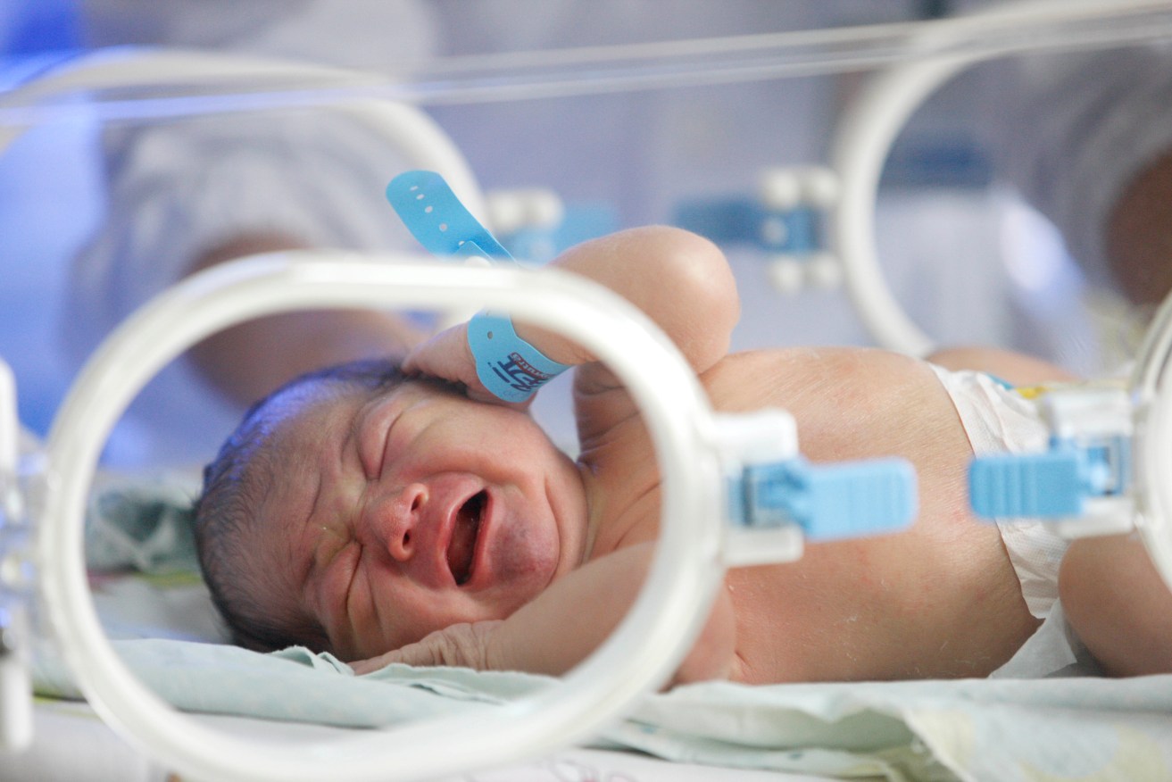 --FILE--A newborn infant is pictured at a hospital in Huaibei city, east China's Anhui province, 22 November 2013. A total of 17.58 million new babies were born in Chinese hospitals in 2017, according to figures released by the National Health Commission. About 51 percent of the newborns were not the first child in their families, said the commission. In response to a rapidly aging population, China allowed married couples to have two children from 2016, ending its decades-long one-child policy.  (Imaginechina via AP Images)