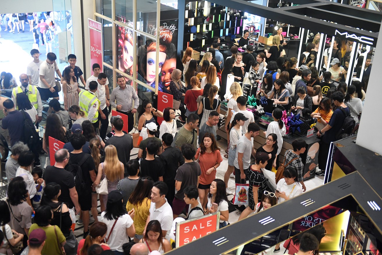 Shoppers are seen at Pitt Street Mall in Sydney. Australian shoppers are set to splurge a record $2.49 billion at the Boxing Day sales, a 5.5 percent increase on last year's figures. (AAP Image/Dylan Coker) 