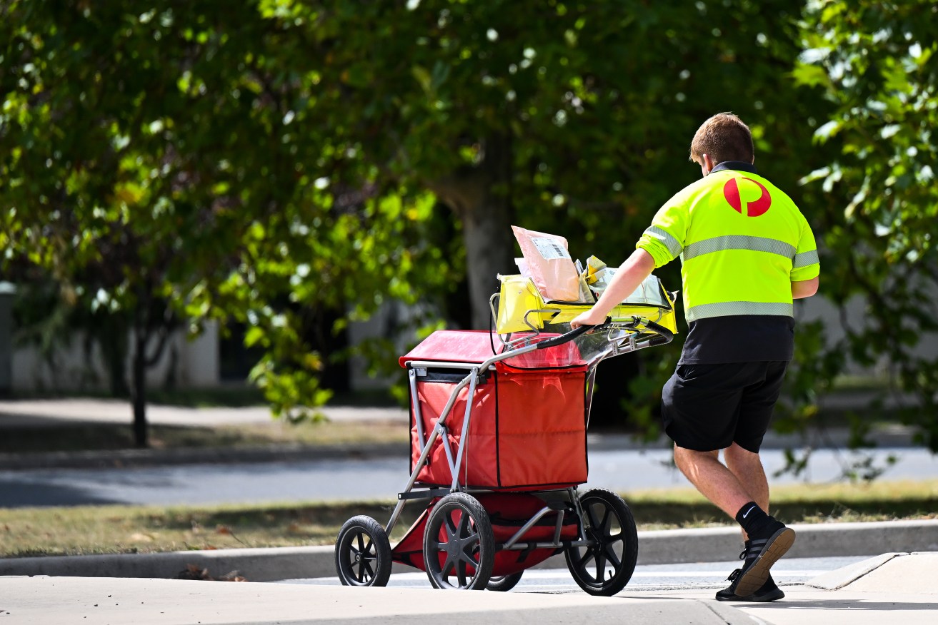 Australia Post will cut back its daily mail deliveries and will only deliver letters every second day as the company faces bankruptcy. (AAP Image/Lukas Coch) NO ARCHIVING