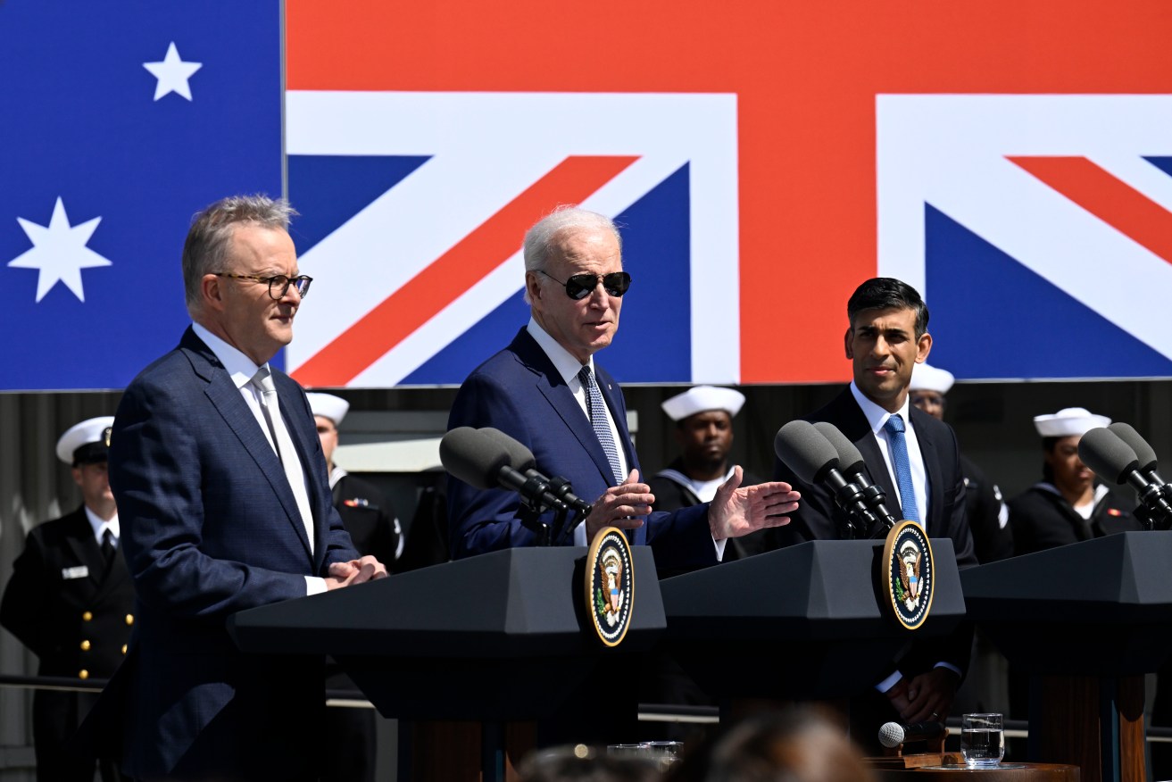 President Joe Biden, center, speaks as Australian Prime Minister Anthony Albanese, left, and British Prime Minister Rishi Sunak listen at Naval Base Point Loma, Monday, March 13, 2023, in San Diego, as they unveil, AUKUS, a trilateral security pact between Australia, Britain, and the United States. (AP Photo/Denis Poroy)