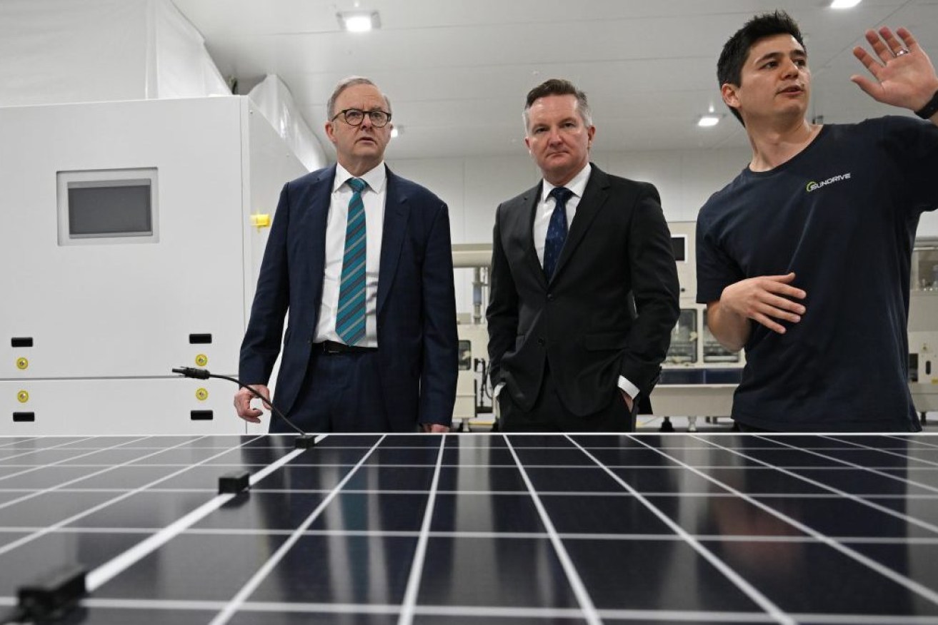 Prime MInister Anthony Albanese (left) and Minister for Climate Change and Energy, Chris Bowen (centre) with founder and CEO Vince Allen (right) during a visit to Sundrive in Sydney, Wednesday, November 1, 2023. Sundrive is Australia’s first mass production facility for solar panels. (AAP Image/Dean Lewins) 