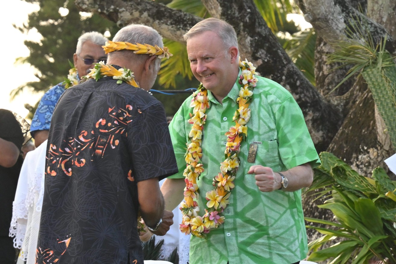 Australia’s Prime Minister Anthony Albanese dances before receiving a gift during a welcome ceremony the Pacific Island Forum (PIF) in Aitutaki, Cook Islands, Wednesday, November 8, 2023. (AAP Image/Mick Tsikas) 