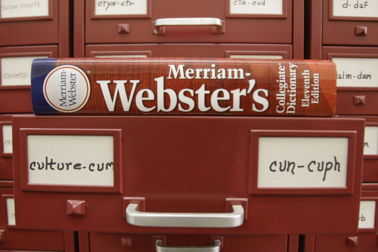 A Merriam-Webster dictionary sits atop their citation files at the dictionary publisher's offices on Dec. 9, 2014, in Springfield, Mass. Merriam-Webster's word of the year for 2023 is “authentic.” (AP Photo/Stephan Savoia, File)