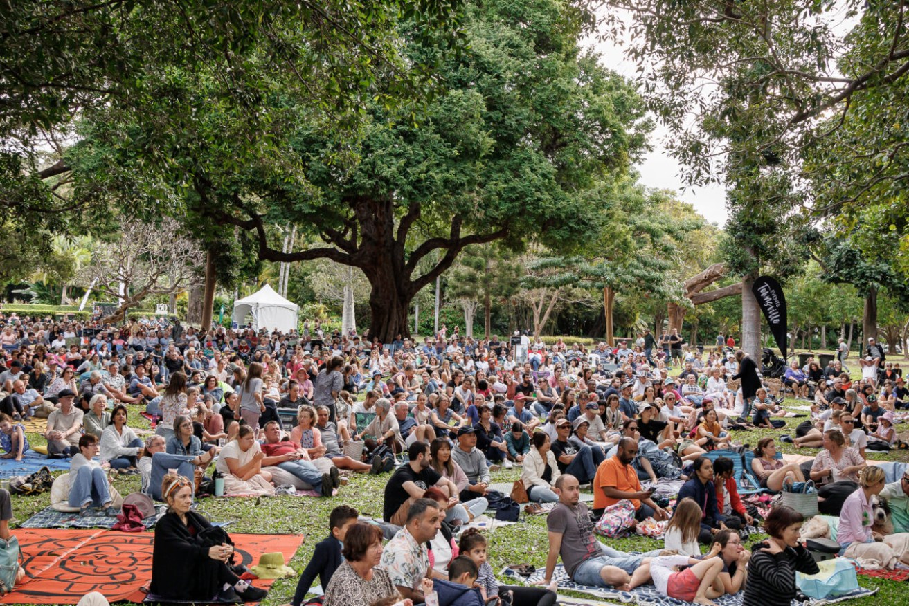 This is what cultural tourism in Queensland looks like - crowds gather in Queens Gardens Townsville during the annual Australian Festival of Chamber Music.