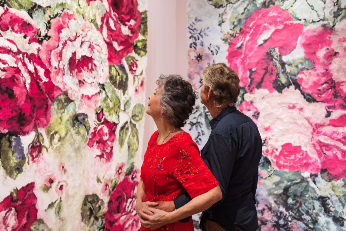 Gallery-goers marvel at the beautiful work of Karen Stone in the latest exhibition at Museum of Brisbane. Photo by Katie Bennett.