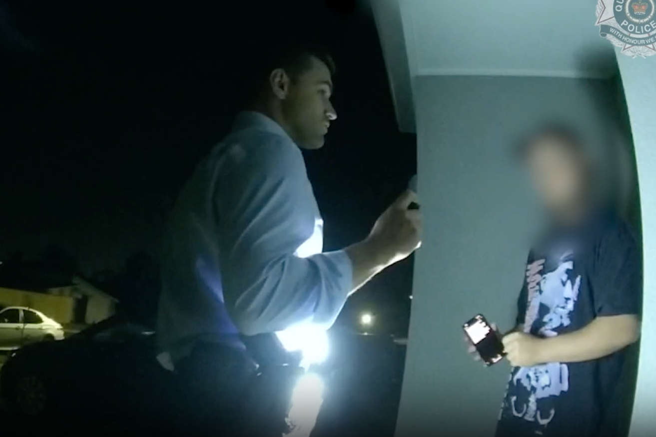 A young man is placed under arrest by Queensland Police (Image: QPS)