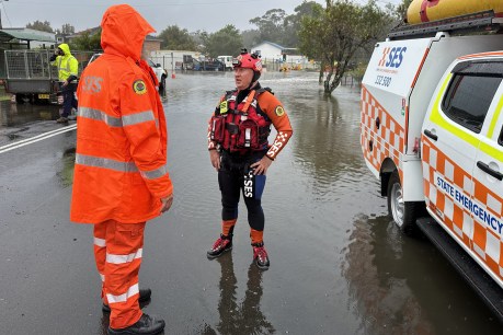 Second town cut off as rains pound Victoria; Queensland battens down for storms