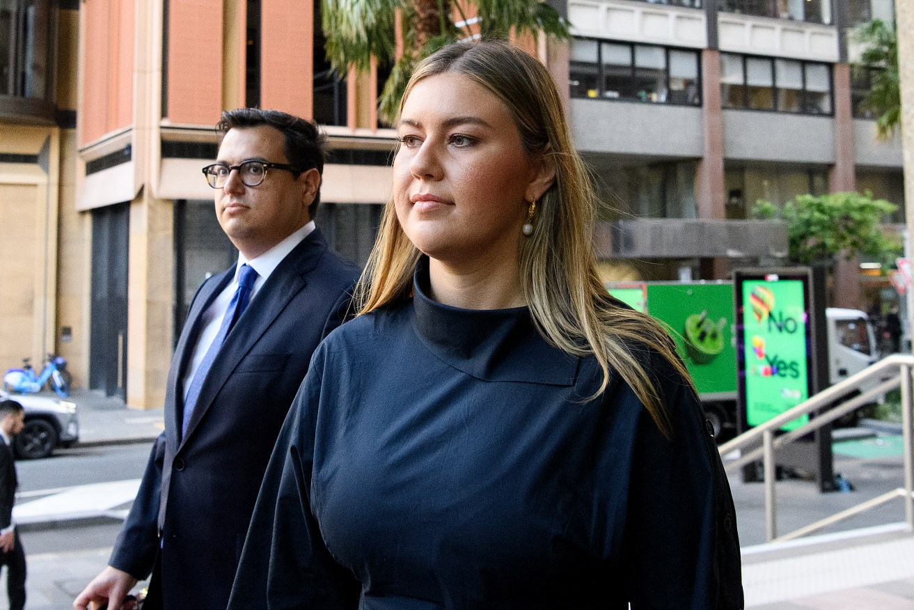 Brittany Higgins (right) arrives at the Federal Court of Australia in Sydney, Friday, December 1, 2023. Lehrmann is suing Network Ten and journalist Lisa Wilkinson in the Federal Court, claiming their interview with Brittany Higgins on The Project in February 2021 defamed him. (AAP Image/Bianca De Marchi) 