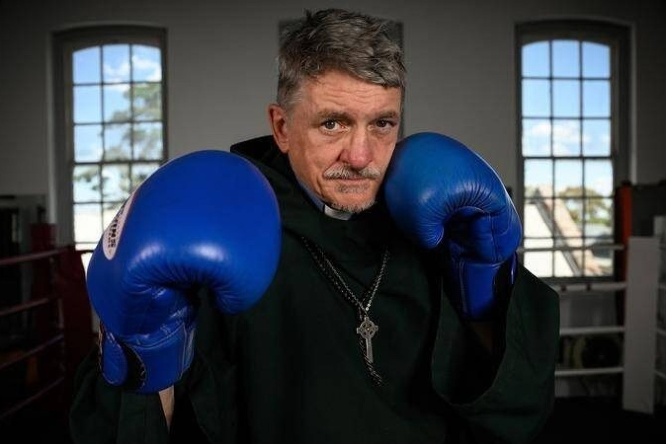 Father Dave Smith is fighting for a better future, in and out of the ring. (Image: Dan Himbrechts/AAP)
