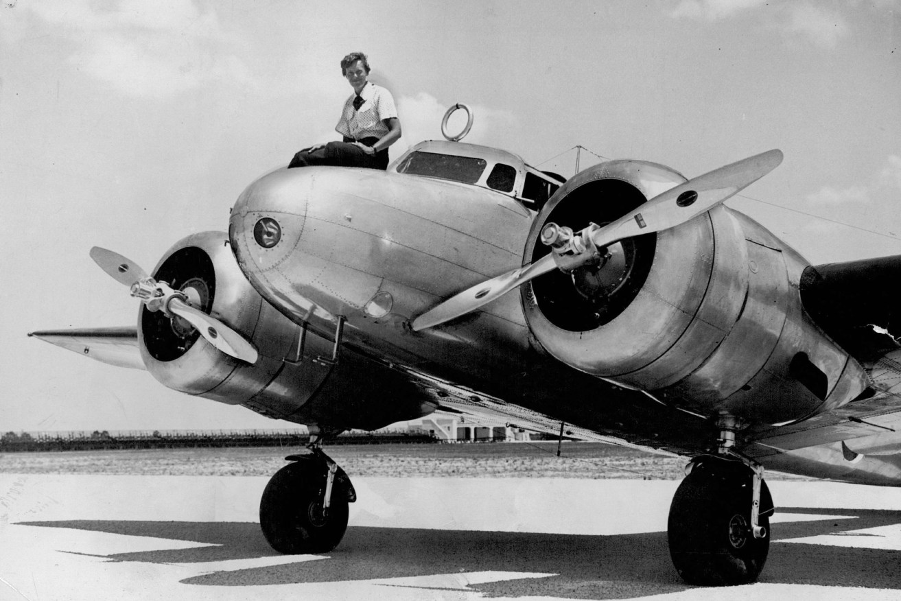 This 1937 photo shows Amelia Earhart before takeoff in Miami for an attempted round-the-world flight. Earhart and her navigator, Fred Noonan, disappeared in the South Pacific in July 1937, while on one of the last legs of that journey. (The Miami Herald via AP)