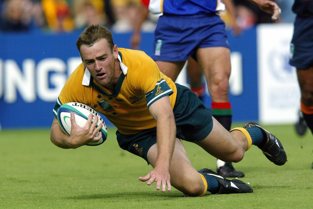File photo dated 25-10-2003 of Chris Latham goes over to score the second of his five tries in Australia's 142-0 victory over Namibia . Photo credit  David Davies/PA Wire.
