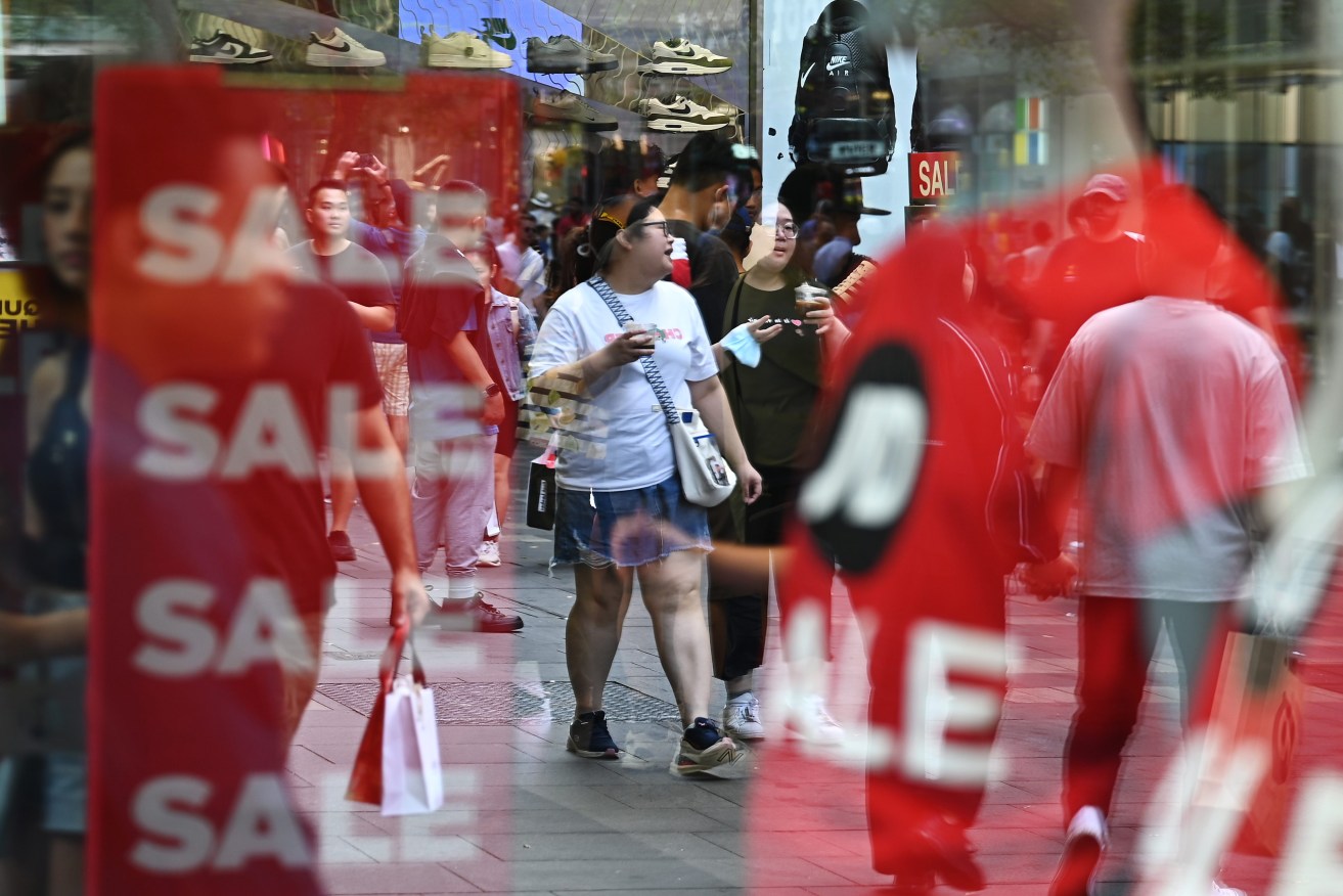 Shoppers are seen during Boxing Day sales in Sydney, Tuesday, December 26, 2023. Millions of Australians are expected to splurge at unprecedented sales on Boxing Day spurred on by a cost-of-living crisis this year. (AAP Image/Steven Saphore) 
