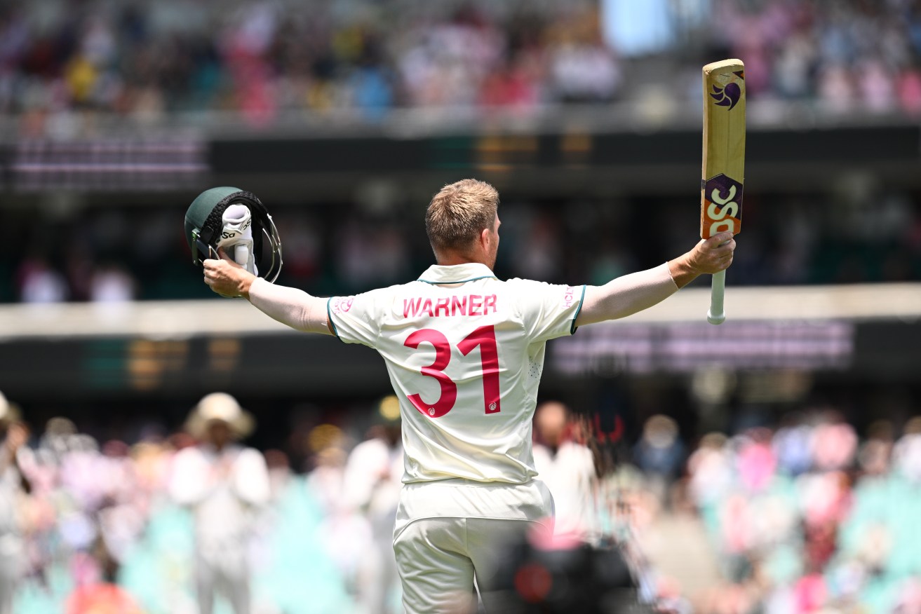 David Warner of Australia gestures to the crowd as he leaves the field in his final Test match,(AAP Image/Dan Himbrechts) 