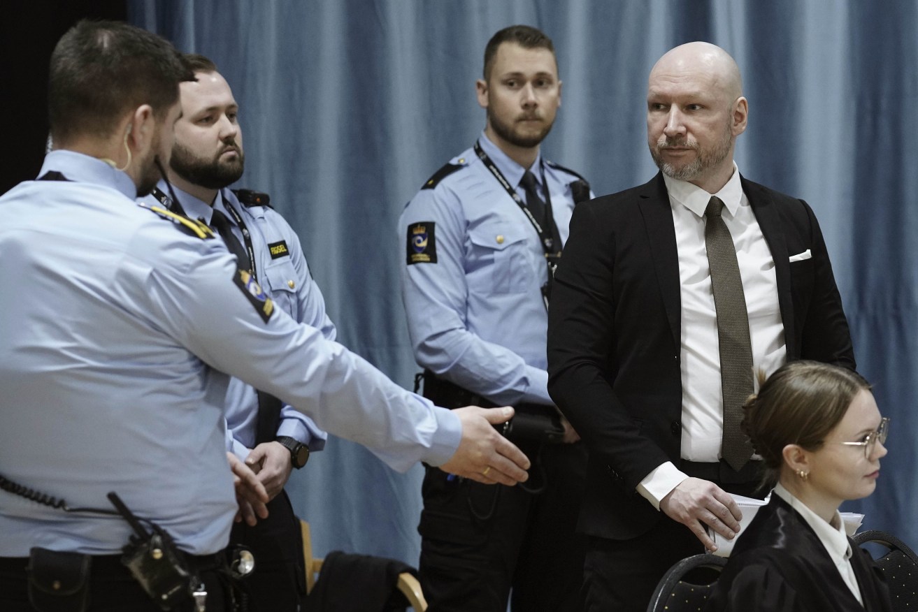 Right-winged extremist Anders Behring Breivik center, enters the Oslo district court conducting his case . Breivik, who slayed 77 people in an anti-Islamic bomb and gun rampage in 2011, appeared in court on Monday in a bid to sue the Norwegian state for breaching his human rights. (Cornelius Poppe/NTB Scanpix via AP)