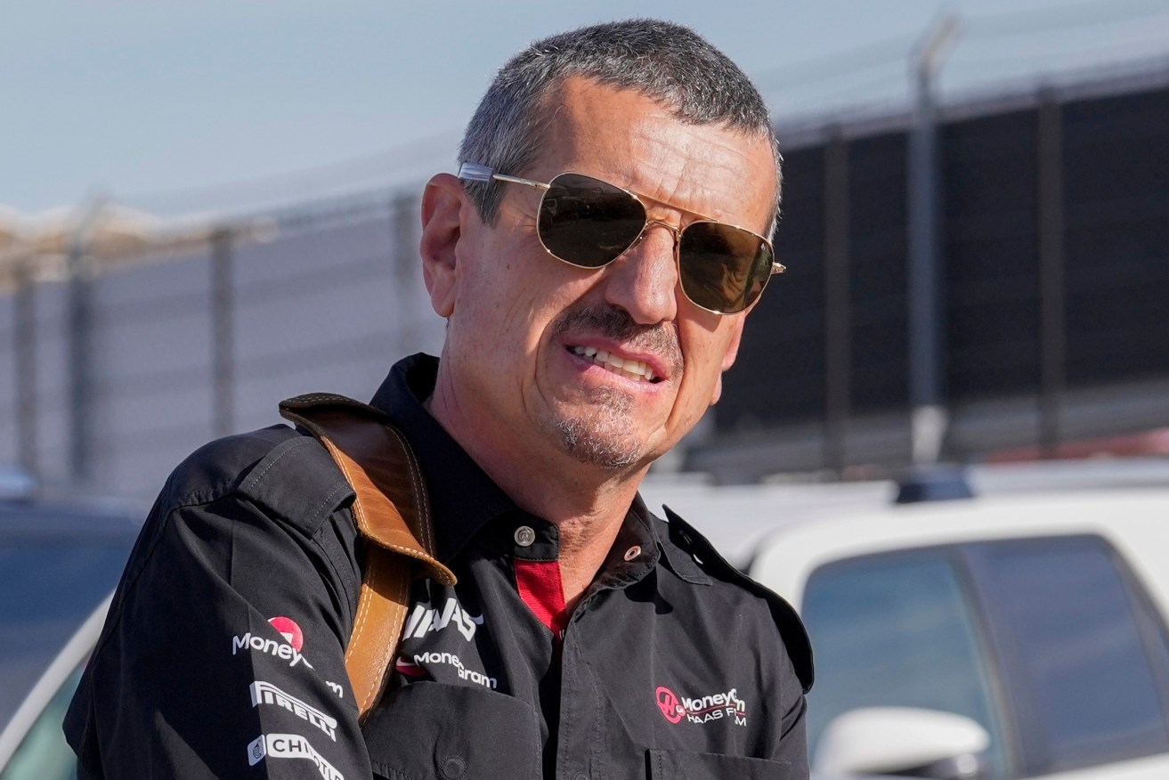 FILE - Guenther Steiner arrives before the sprint shootout ahead of the Formula One U.S. Grand Prix auto race at Circuit of the Americas, Saturday, Oct. 21, 2023, in Austin, Texas. Steiner, the first employee hired by Haas F1 and one of the stars of the Netflix docuseries on Formula One, has not been retained as team principal after a decade with the organization. Gene Haas made the announcement Wednesday, Jan. 10, 2024, and said director of engineering Ayo Komatsu, who started with Haas as chief race engineer in its 2016 debut season, will now oversee competition elements of the business as team principal.(AP Photo/Nick Didlick, File)