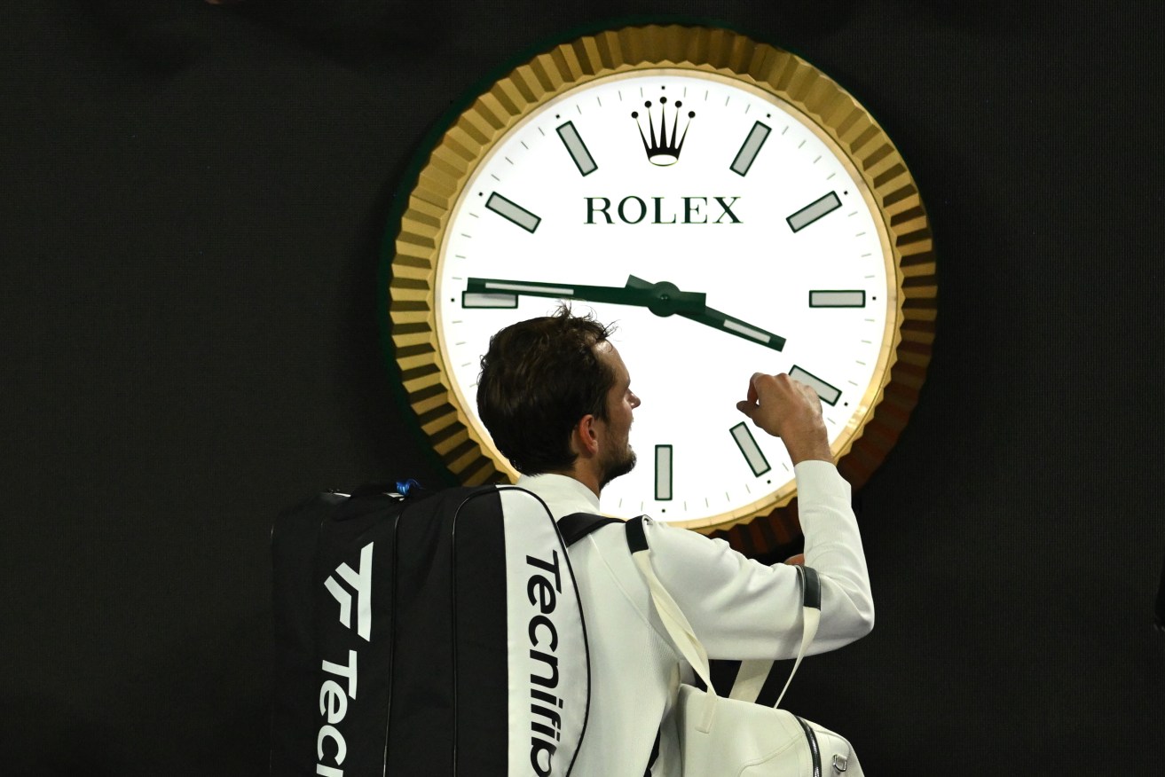 Daniil Medvedev of Russia walks past the clock after winning his 2nd round match against Emil Ruusuvuori of Finland on Day 5 of the 2024 Australian Open at Melbourne Park in Melbourne, Thursday, January 18, 2024. (AAP Image/Lukas Coch) 
