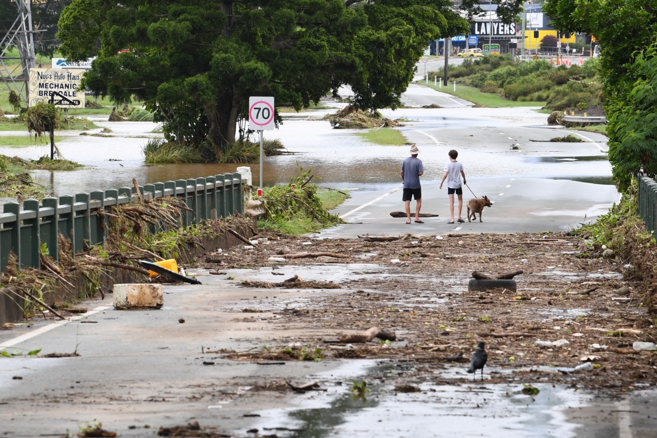 A flooded South Pine River is seen over a bridge in Strathpine, north of Brisbane, Tuesday January, 30th, 2024. Heavy rain has lashed an already soaked southeast Queensland, as ex-tropical cyclone Kirrily delivers more wet weather in the state's northwest.  (AAP Image/Jono Searle) NO ARCHIVING