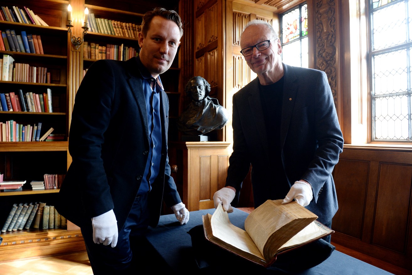 Bell Shakespeare theatre company Co-Artistic Directors Peter Evans and John Bell inspect a rare Shakespeare folio dating to 1623, at the State Library of NSW, in Sydney, Tuesday, April 22, 2014. Tomorrow marks the 450th anniversary of the birth of William Shakespeare. (AAP Image/Dan Himbrechts) 