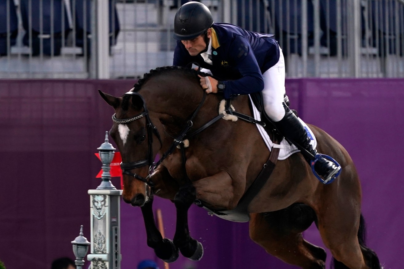 Australia's Shane Rose, riding Virgil, competes during the equestrian eventing jumping at Equestrian Park in Tokyo at the 2020 Summer Olympics, Monday, Aug. 2, 2021, in Tokyo, Japan. (AP Photo/Carolyn Kaster)