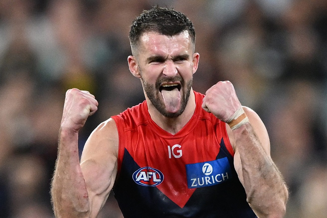 Joel Smith of the Demons reacts after kicking a goal during the AFL Semi-final between the Melbourne Demons and Carlton Blues at the MCG in Melbourne, Friday, September 15, 2023. (AAP Image/James Ross) 