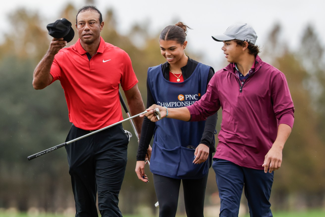 Tiger Woods, left; daughter Sam, center; and son Charlie, right; during the final round of the PNC Championship golf tournament in Orlando, Fla. (AP Photo/Kevin Kolczynski)
