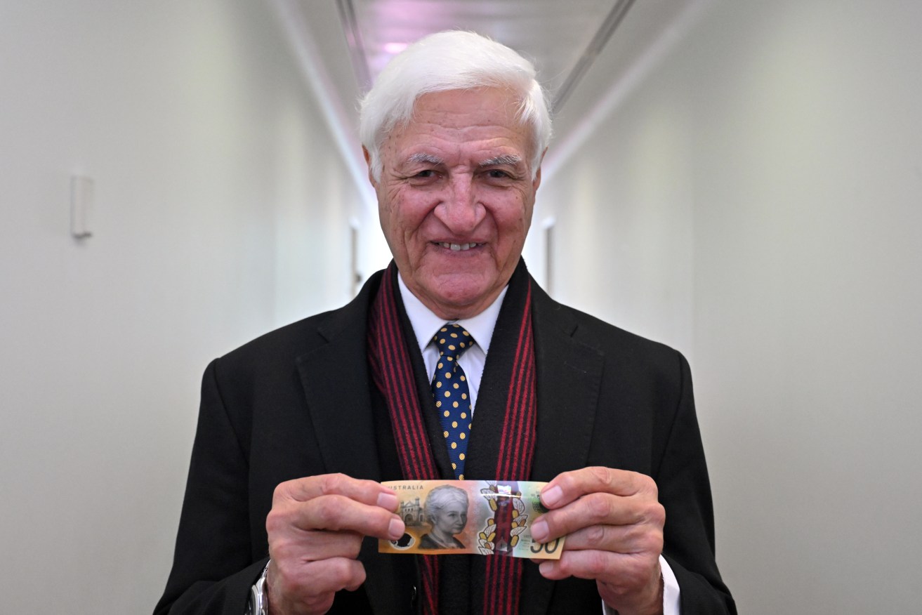 Katter’s Australian Party Member for Kennedy Bob Katter holds cash at Parliament House in Canberra, Wednesday, February 7, 2024. (AAP Image/Mick Tsikas) NO ARCHIVING