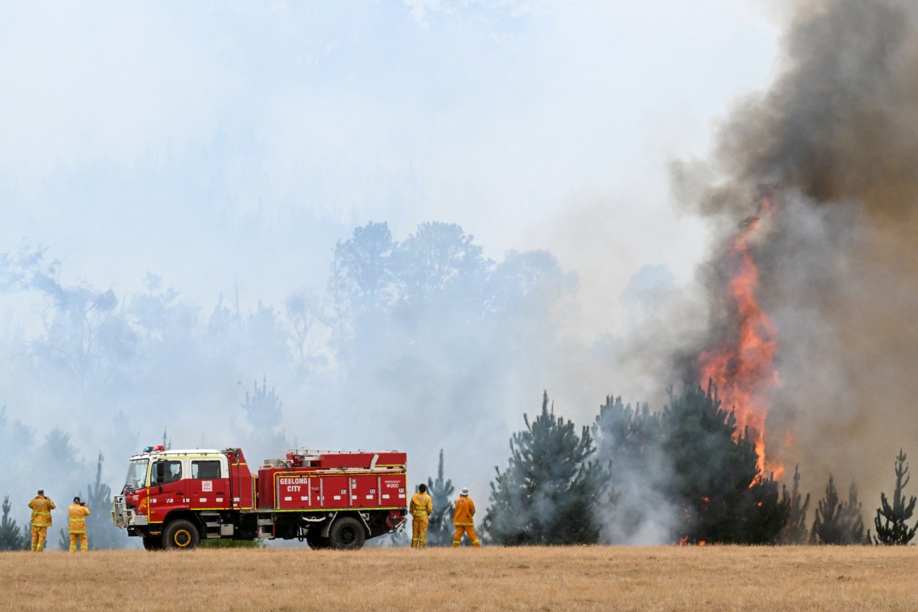 A CFA strike team is seen at a fire near Raglan in Victoria, Friday, February 23, 2024. More than 1000 firefighters are working to contain a large bushfire raging in western Victoria as hot conditions set in across NSW. (AAP Image/James Ross)