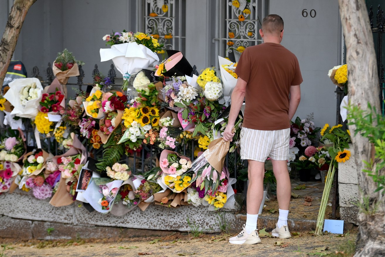 Members of the public place floral tributes at the Paddington residence of Jesse Baird in Sydney, Wednesday, February 28, 2024. Police have located the bodies of two missing men, who investigators allege were killed more than a week earlier in Sydney by a NSW officer.(AAP Image/Bianca De Marchi) NO ARCHIVING
