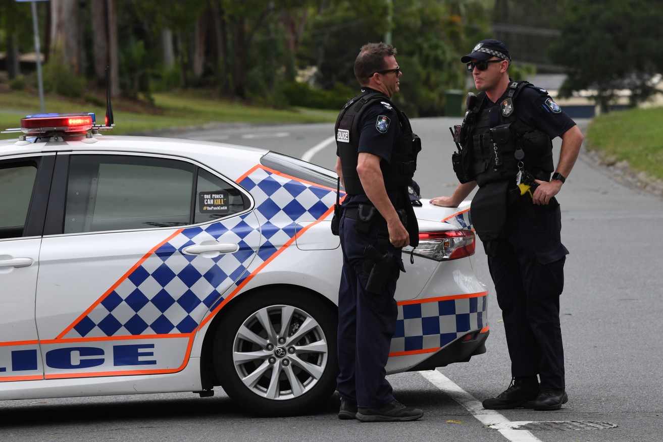  FILE PHOTO: A man was shot in the neck by a group of alleged intruders into a house south of Brisbane (AAP Image/Darren England) 