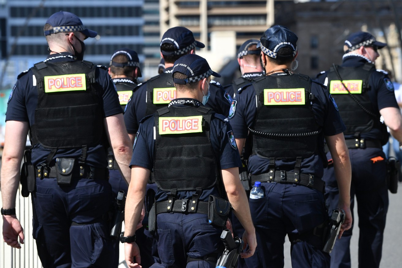 Queensland Police will deploy officers to hot spots around the state to target repead offienders. . (AAP Image/Darren England) 