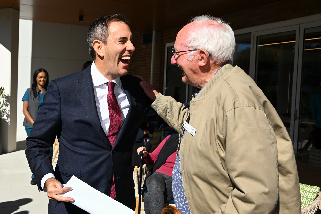 Australian Treasurer Jim Chalmers speaks to a resident during a visit to Goodwin Village Aged Care in Canberra (AAP Image/Lukas Coch) 