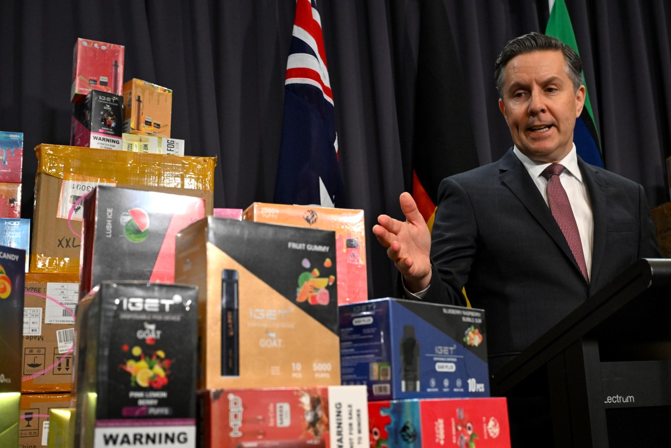 Australian Health Minister Mark Butler displays vaping material during a press conference at Parliament House in Canberra, Wednesday, February 28, 2024. (AAP Image/Lukas Coch) 
