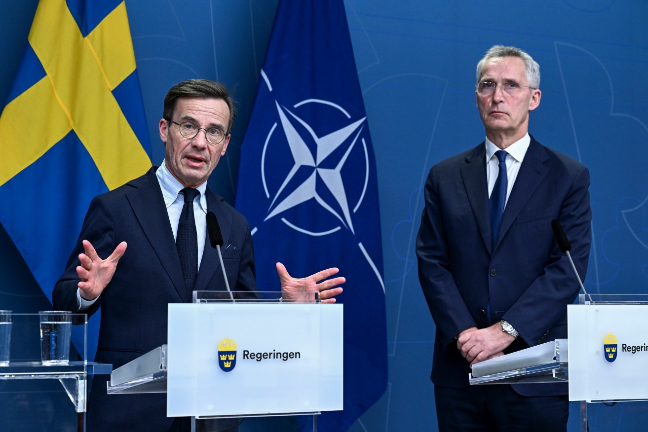 FILE - Sweden's Prime Minister Ulf Kristersson and NATO Secretary General Jens Stoltenberg during a press conference after a meeting with all Swedish party leaders who are in favor of a Swedish NATO membership in Stockholm, Sweden, Tuesday, March 7, 2023. As Sweden joins NATO, it bids a final farewell to more than two centuries of neutrality (Jonas Ekstromer/TT News Agency via AP, File)