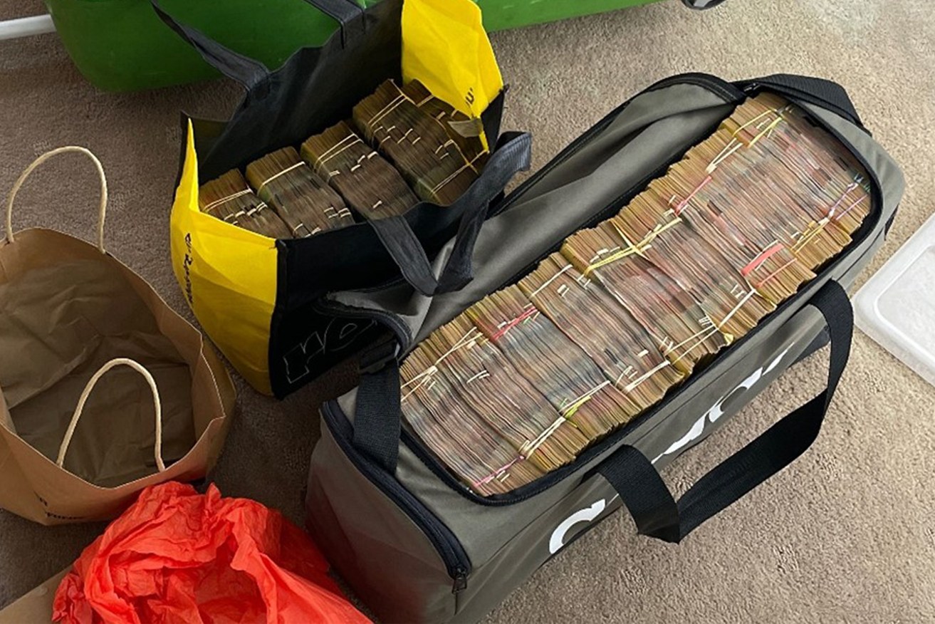 A supplied image shows about $1.95 million in cash located during a search warrant at a home in Hope Island on the Gold Coast, Monday, March 04, 2024. Two Russian nationals will face court after being charged over $2.3 million in cash and cryptocurrency laundering on the Gold Coast. (AAP Image/Supplied by Australian Federal Police) NO ARCHIVING, EDITORIAL USE ONLY