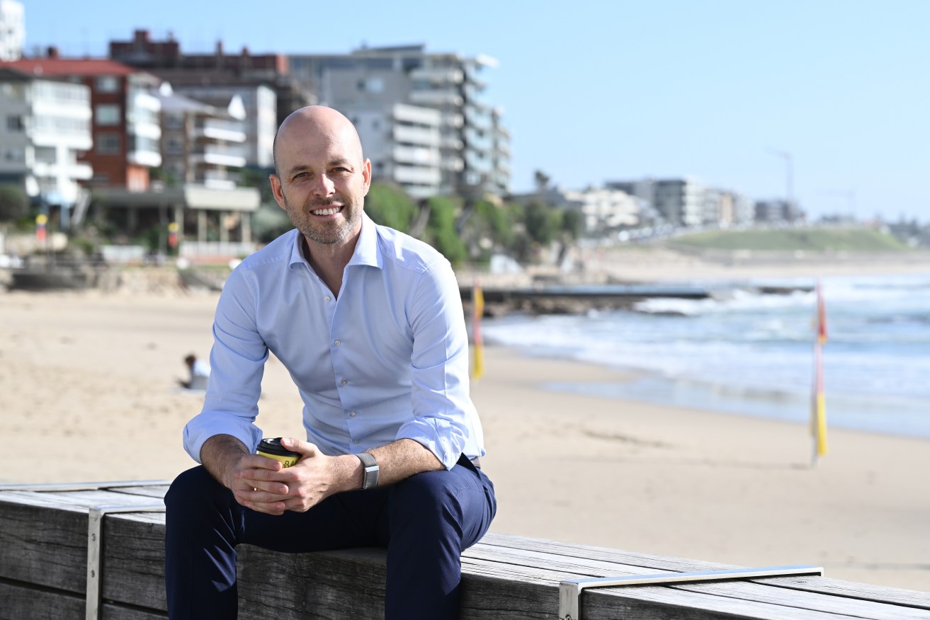 Federal Liberal candidate for the seat of Cook, Simon Kennedy, poses for a photograph at Cronulla beach in Sydney, Tuesday, March 5, 2024. (AAP Image/Dan Himbrechts)