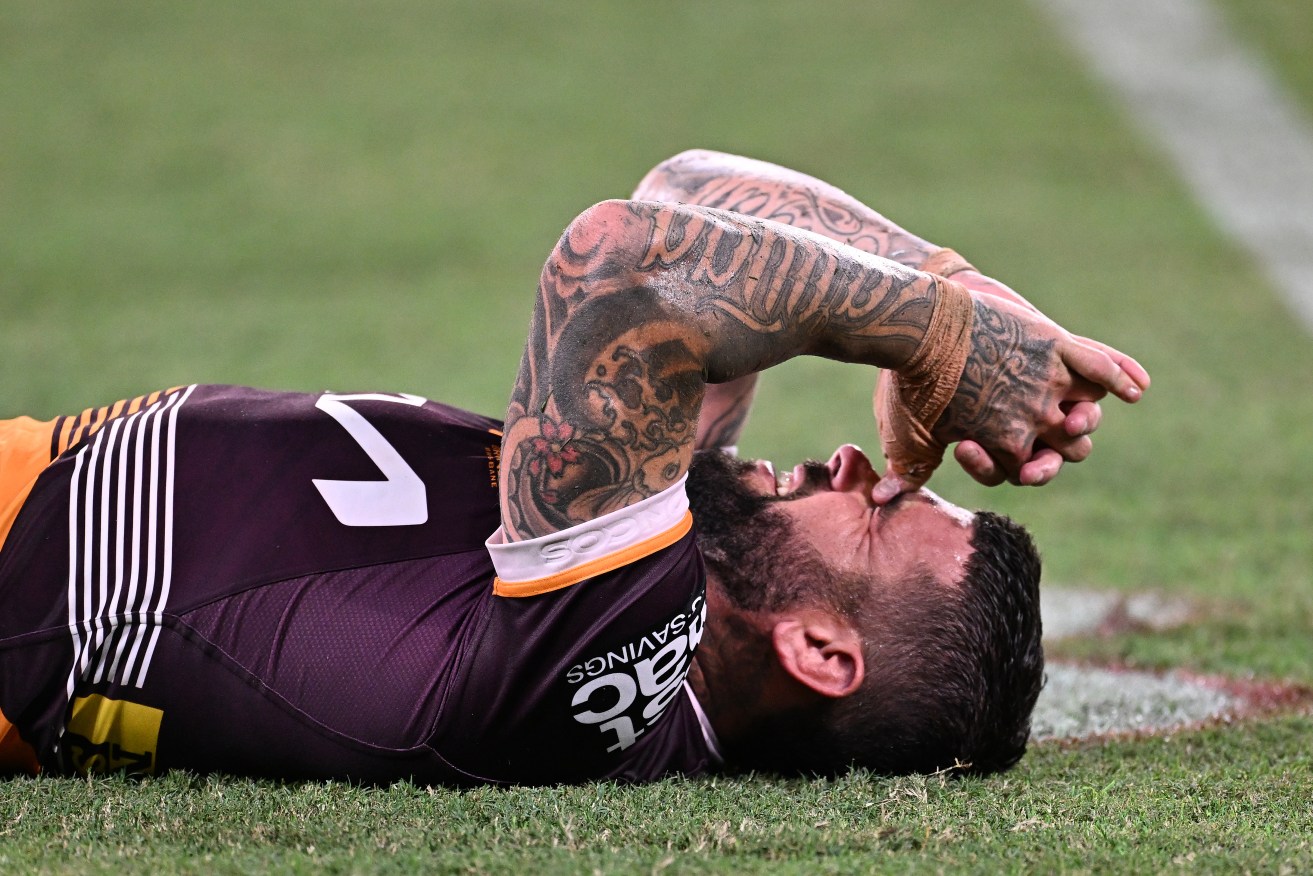 Adam Reynolds of the Broncos reacts after sustaining an injury during the NRL Round 2 match between the Brisbane Broncos and the South Sydney Rabbitohs at Suncorp Stadium in Brisbane, Thursday, March 14, 2024. (AAP Image/Dave Hunt) NO ARCHIVING, EDITORIAL USE ONLY