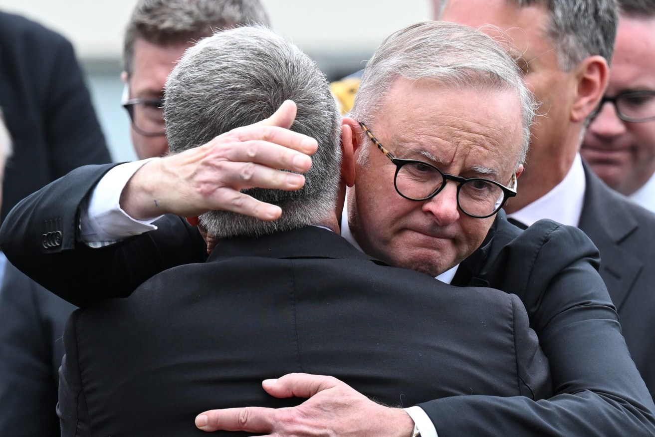 Australian Prime Minister Anthony Albanese hugs former Defence Minister  Joel Fitzgibbon, the father of Lance Corporal Jack during his son’s funeral at St. Joseph's Catholic Church, Cessnock. Son of former Labor defence minister Joel Fitzgibbon, Lance Corporal Fitzgibbon tragically died following a parachuting incident that occurred during military training in March 2024. (AAP Image/Dean Lewins) 