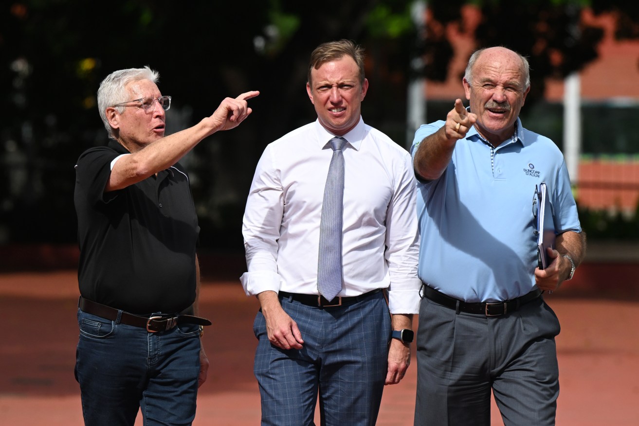 It's over there. Or over here. Suncorp Stadium General Manager Alan Graham (left), Queensland Premier Steven Miles (centre) and former Rugby League great Wally Lewis (right) are seen at Suncorp Stadium(AAP Image/Darren England) 