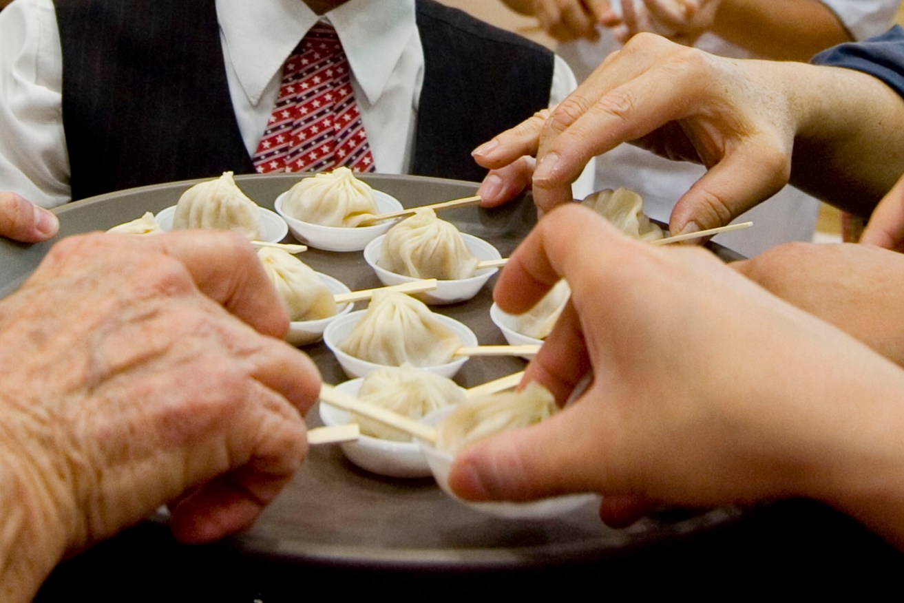 Chefs from Taipei-based global chain Din Tai Fung make hand made dumplings during the travel expo at Darling Harbour in Sydney, Saturday, March 14, 2009. (AAP Image/Jenny Evans) NO ARCHIVING