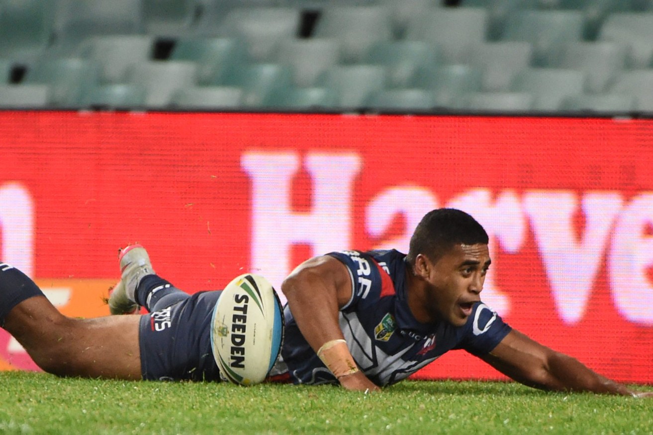 Roosters centre Michael Jennings scores a try during the round 21 NRL match between the Sydney Roosters and the Canterbury-Bankstown Bulldogs at Allianz Stadium in Sydney, Friday, July 31, 2015. (AAP Image/Mick Tsikas) 