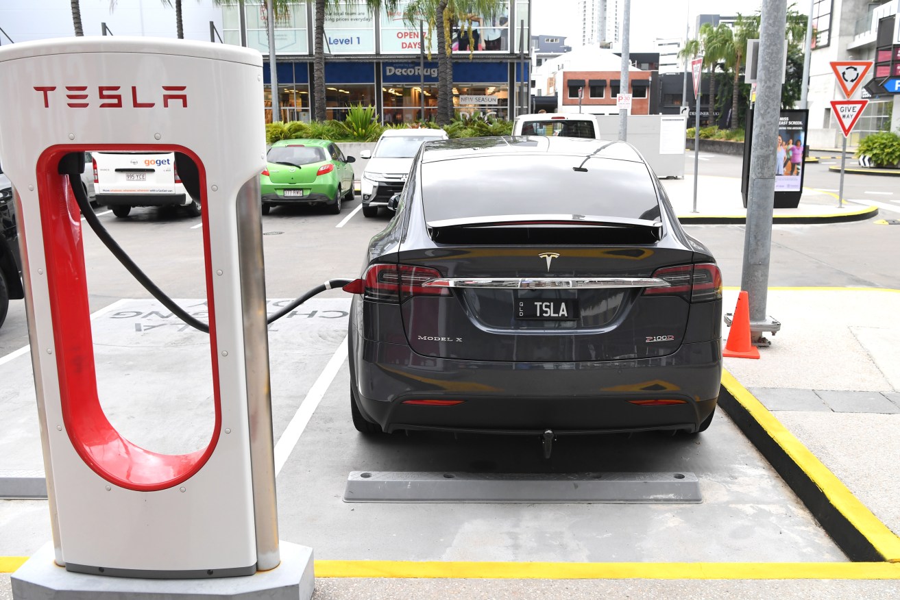 A stock image of a Tesla model X car being charged in Brisbane, Wednesday, February 27, 2019. (AAP Image/Dan Peled) NO ARCHIVING