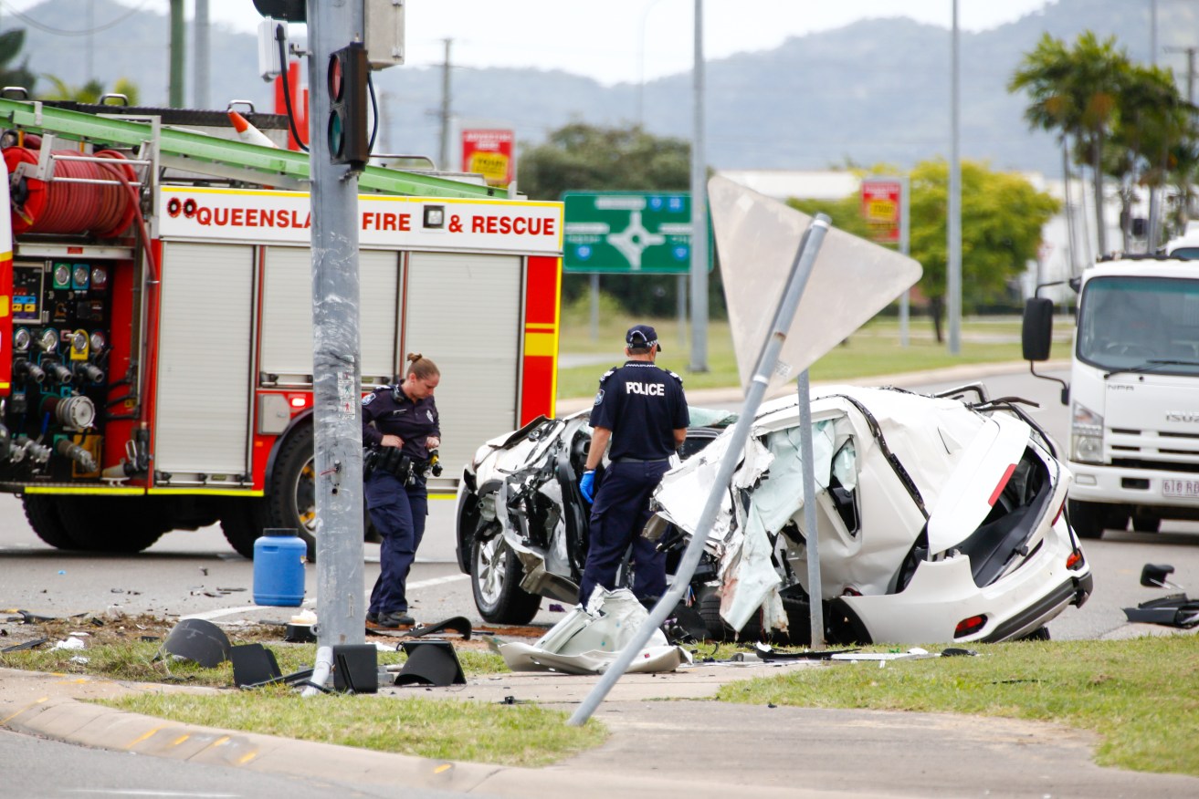 Police work at the scene of a fatal car crash in Townsville, QLD, Sunday, June 7, 2020. A 14-year-old boy was driving a stolen vehicle that crashed, killing four other teenagers, in suburban Townsville early on Sunday. (AAP Image/Michael Chambers) NO ARCHIVING