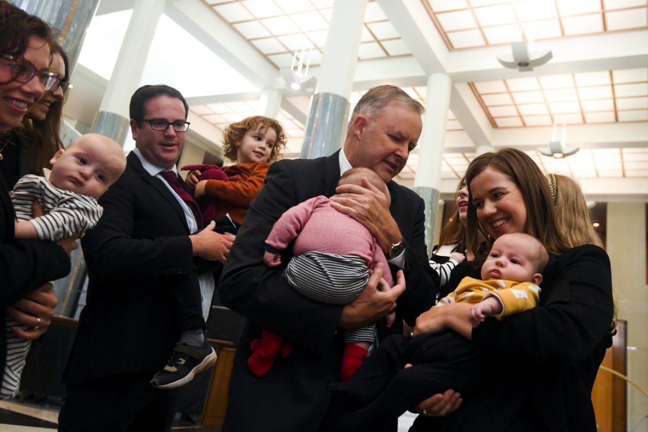 Australian Opposition Leader Anthony Albanese holds baby Benedict as he meets with fellow Labor MPs Amanda Rishworth, Anika Welss, Alicia Payne, Kate Thwaites and Matt Keogh ahead of a press conference on Labor’s childcare plans at Parliament House in Canberra, Monday, March 15, 2021. (AAP Image/Lukas Coch) NO ARCHIVING