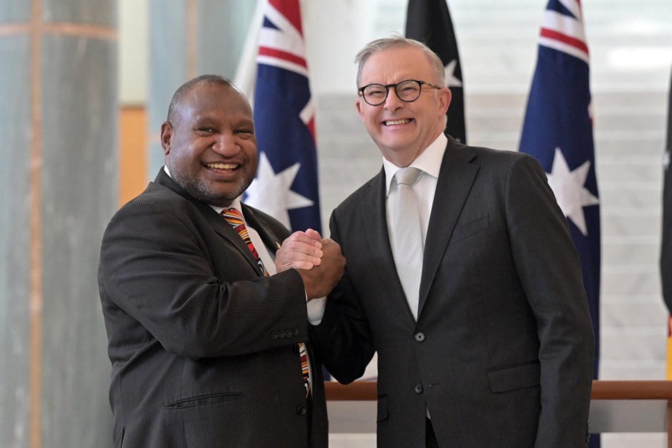 Australia’s Prime Minister Anthony Albanese and Papua New Guinea’s Prime Minister James Marape after signing the visitors book at Parliament House in Canberra, Thursday, February 8, 2024. (AAP Image/Mick Tsikas) NO ARCHIVING