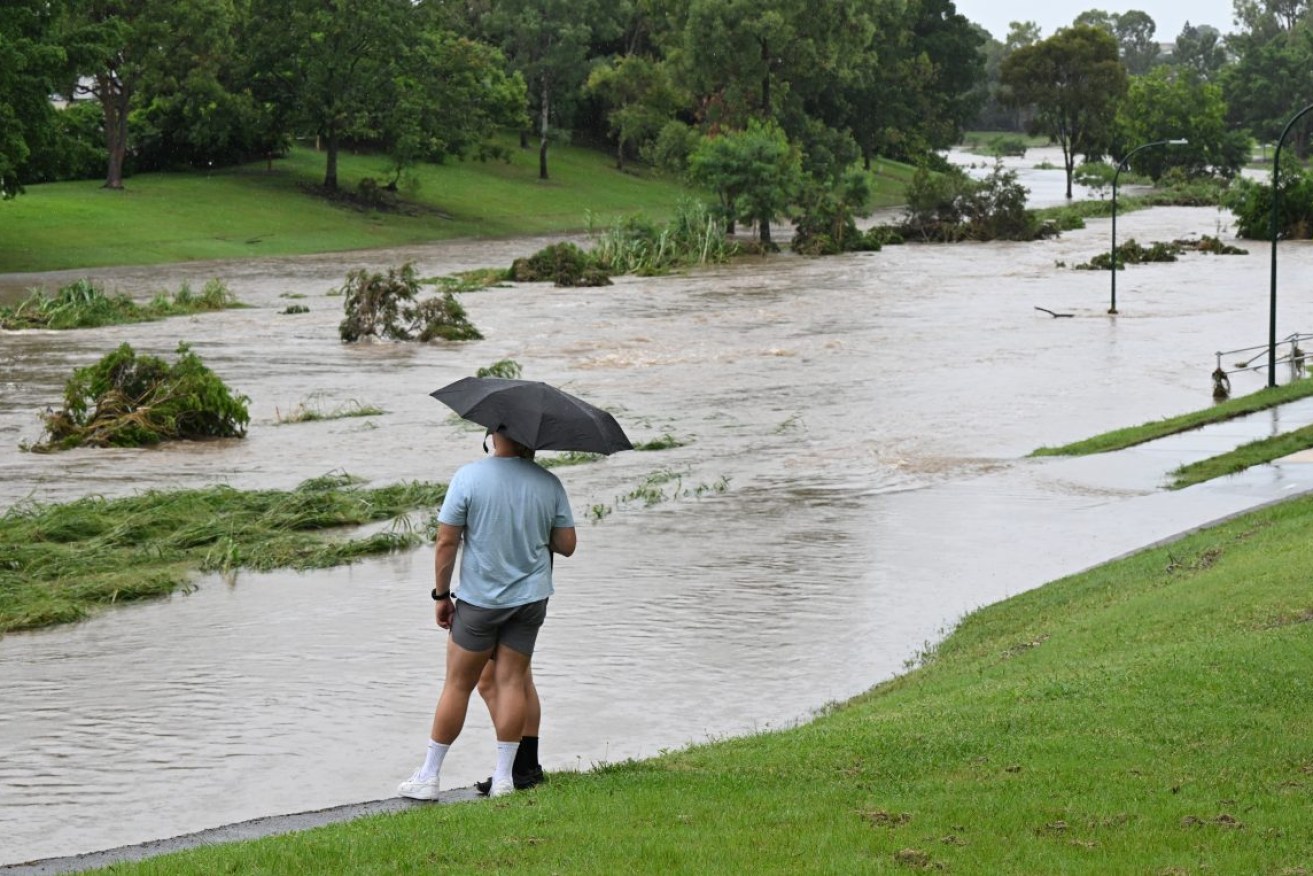 Kedron Brook is seen flooding in the suburb of the Grange in Brisbane earlier this year (AAP Image/Darren England) 