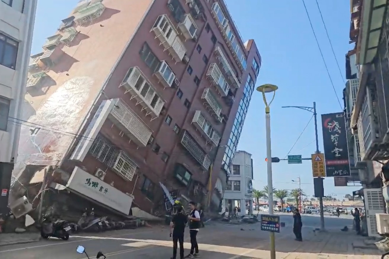 In this image taken from a video footage run by TVBS, a partially collapsed building is seen in Hualien, eastern Taiwan on Wednesday, April 3, 2024. A powerful earthquake rocked the entire island of Taiwan early Wednesday, collapsing buildings in a southern city and creating a tsunami that washed ashore on southern Japanese islands. (TVBS via AP)