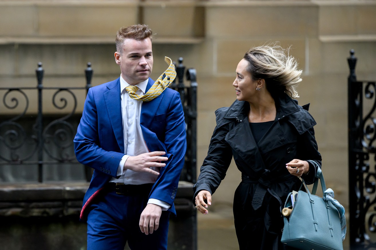 Former Seven network Spotlight producer Taylor Auerbach (left) arrives at the Federal Court of Australia in Sydney, Friday, April 5, 2024. The 28-year-old ex-Liberal staffer Bruce Lehrmann is suing Ten and journalist Lisa Wilkinson over a February 2021 report on The Project during which fellow staffer Brittany Higgins claimed he raped her in a Parliament House office in 2019. (AAP Image/Bianca De Marchi) 